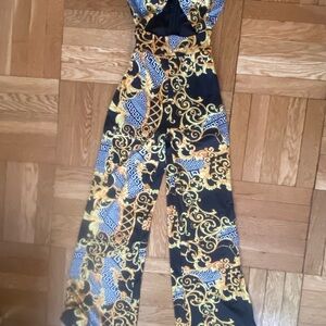 Fashion Nova Black and Gold Patterned Jumpsuit